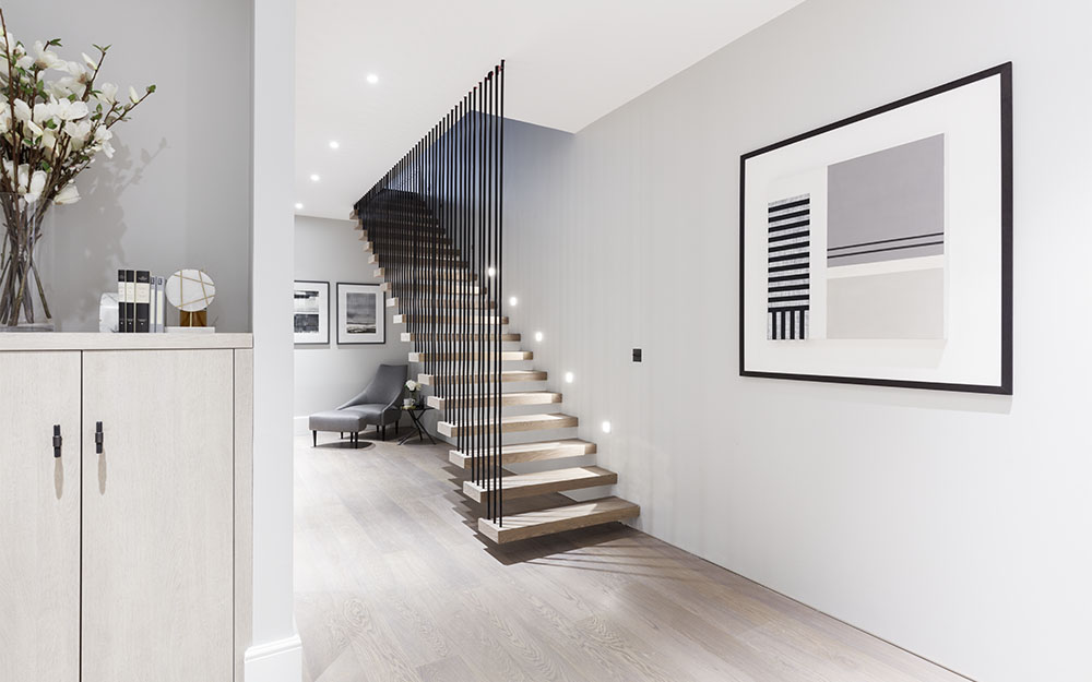 A colour CGI image of a modern wooden staircase at The Arts House renovation - 108-110 Gloucester Road, London - a Henley Space residential development