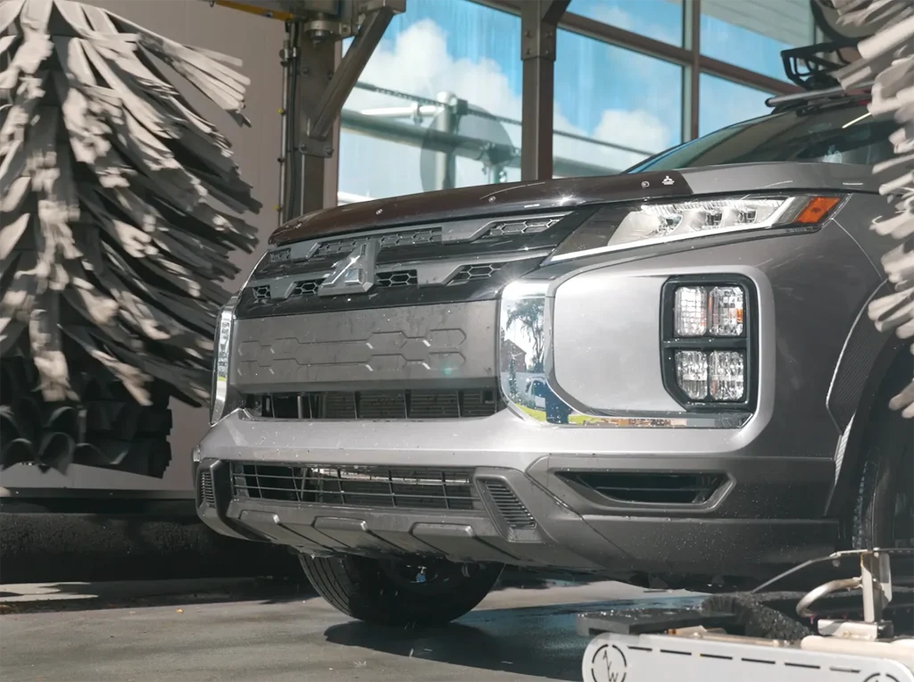 Advanced Wash Technology Vehicle moving through AquaSonic's automated wash technology system