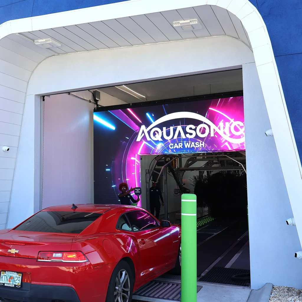 Smart Wash Technology AquaSonic branded wash tunnel featuring digital technology and lighting