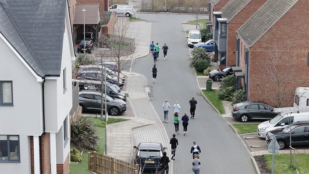 Active Living Communities Residents exercising within a modern residential neighbourhood at Ebbsfleet