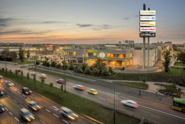 Galeria Pestka shopping centre illuminated at dusk in Poznań, Poland